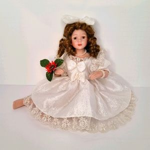 Golden Hair Blue Eye Porcelain Doll with White Dress and Poinsettia Corsage